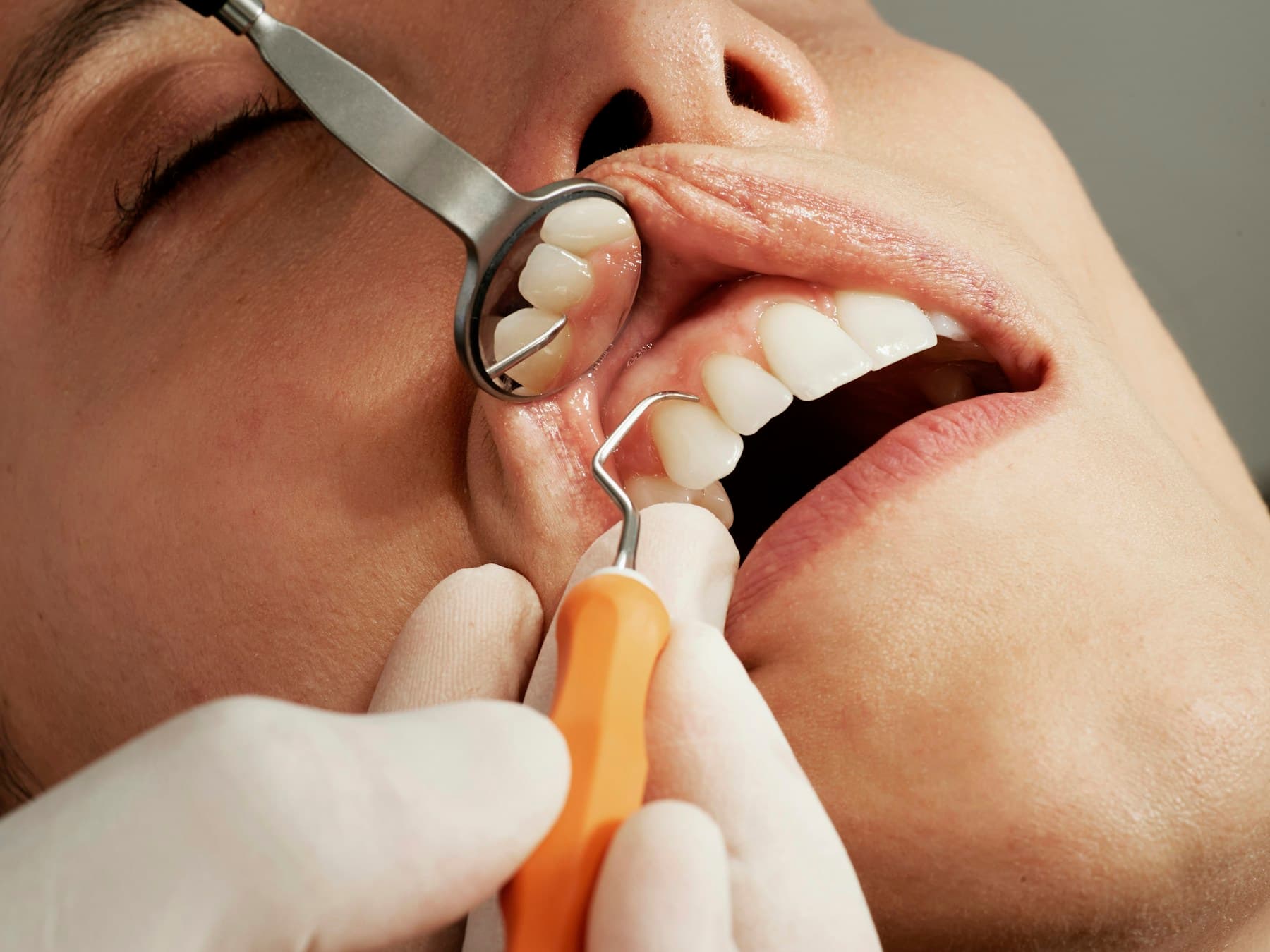 Dentist providing dental care to a patient in a modern clinic